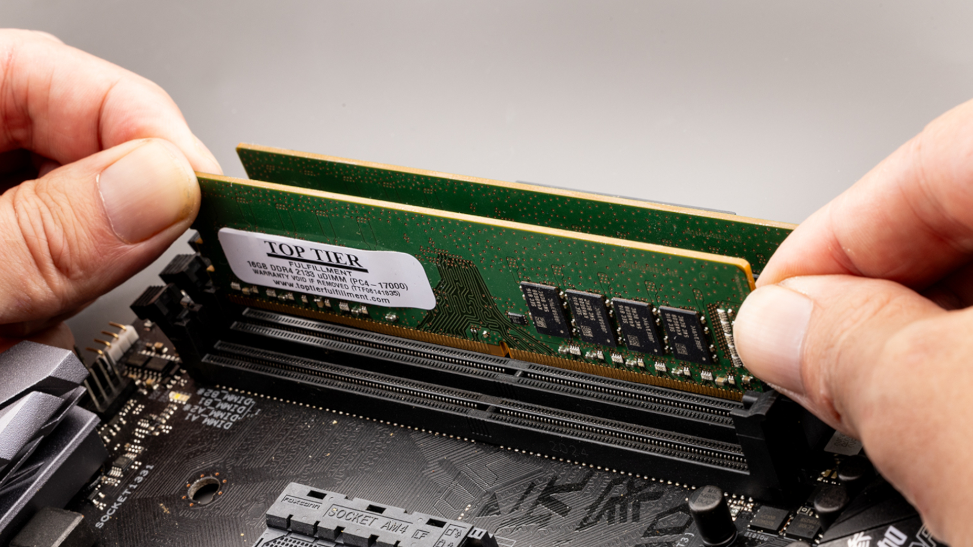 RAM stickes being removed from computer.