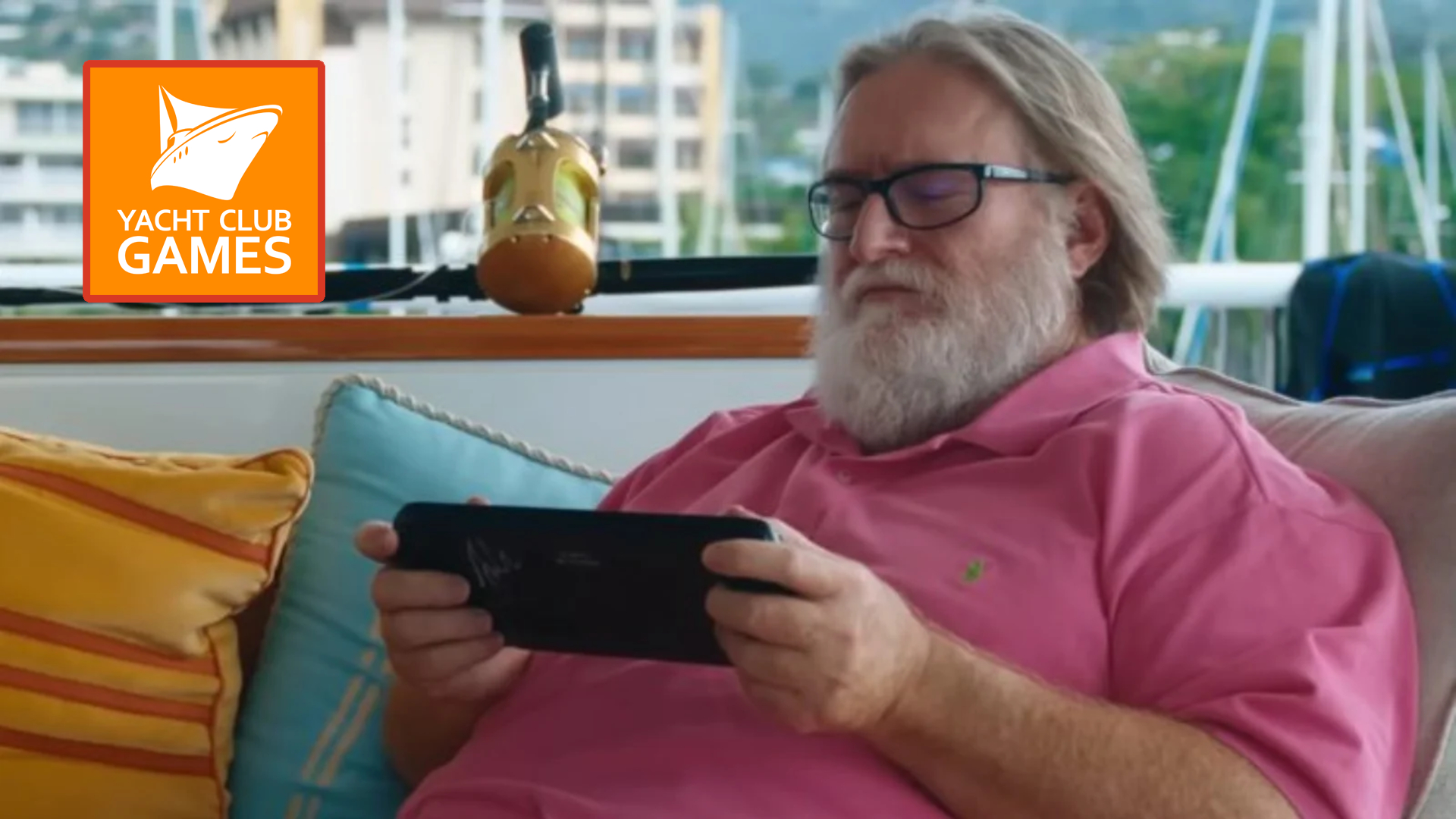 Gabe Newell playing a steam deck on his yacht.